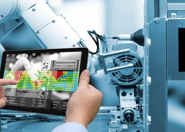Industry 4.0 concept .Man hand holding tablet with Augmented rea